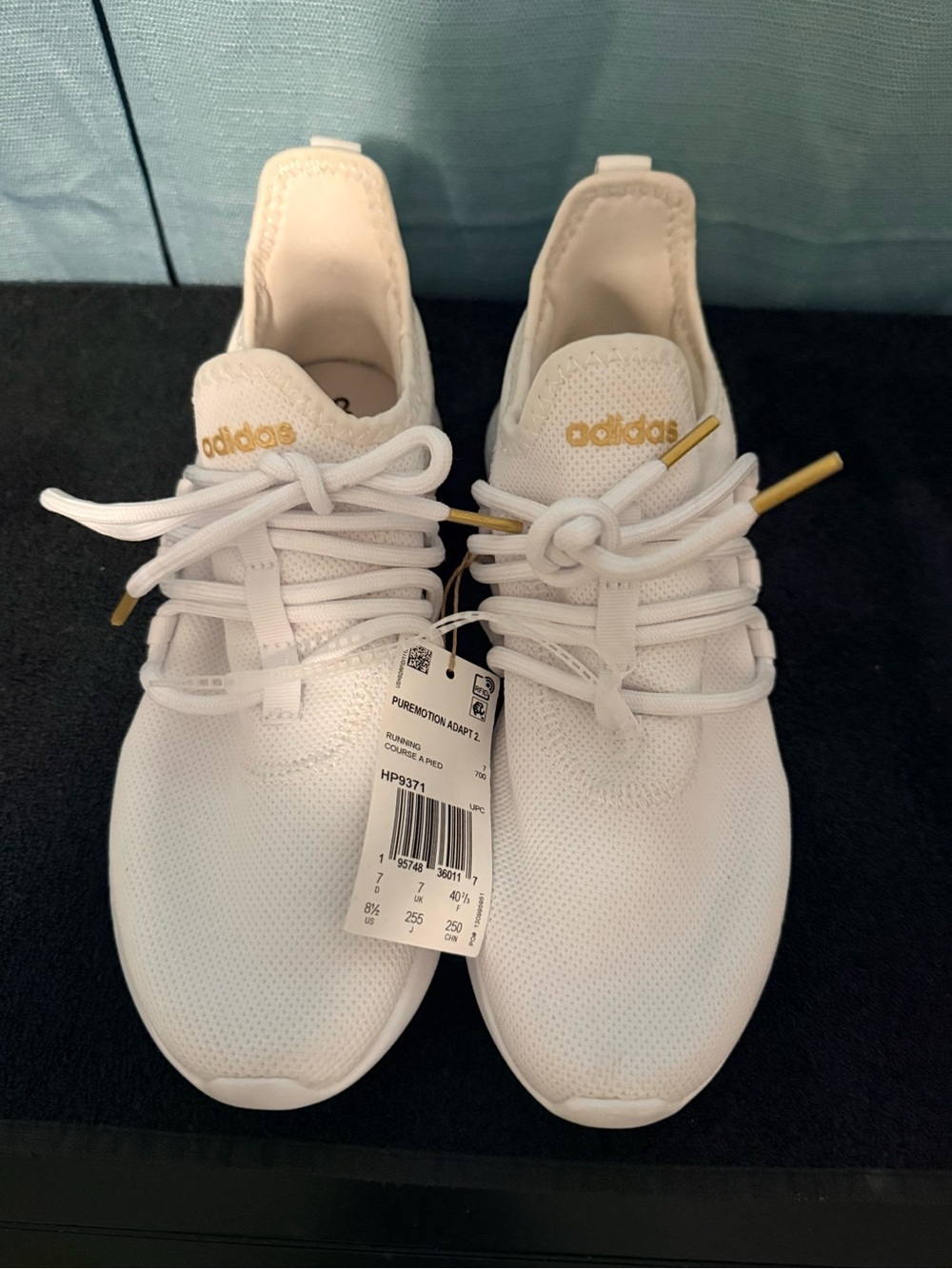 adidas Women’s White Sneakers with Gold Accents